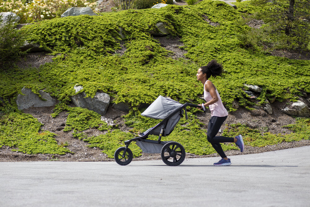 Mom running with jogging stroller